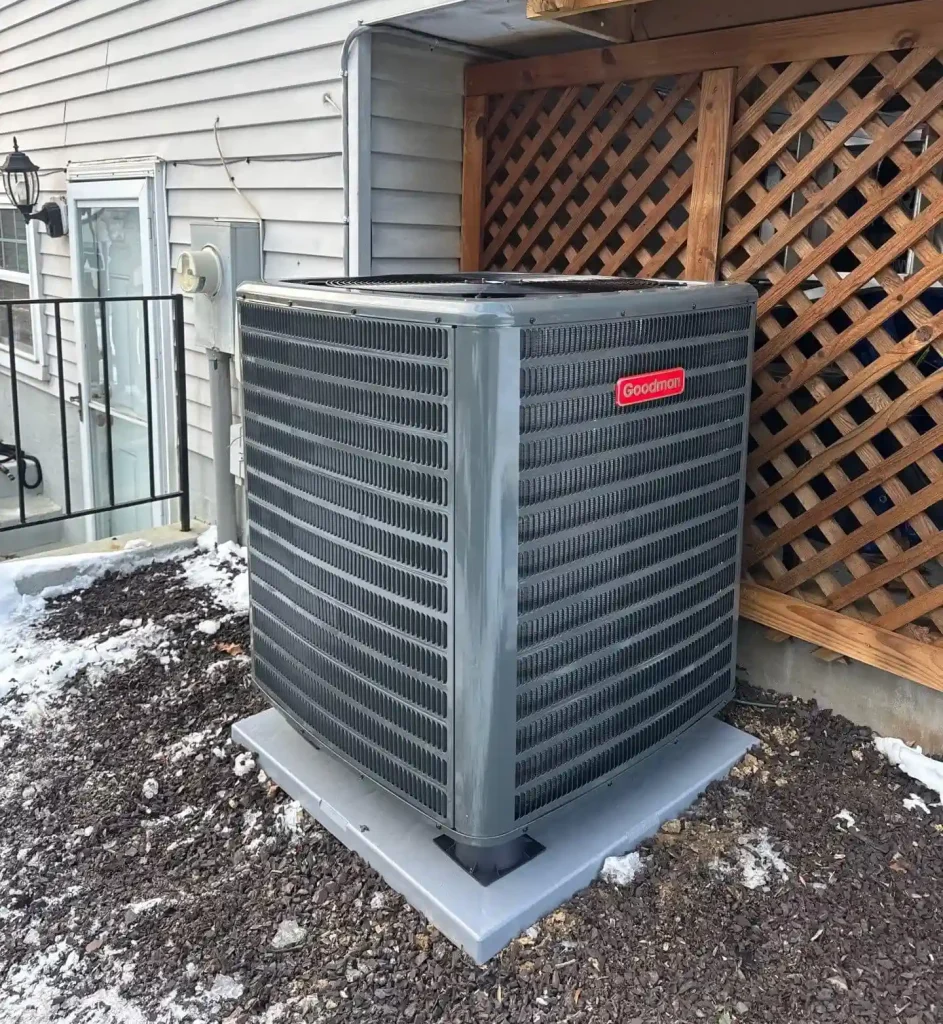 Technician repairing HVAC unit to prevent summer breakdown