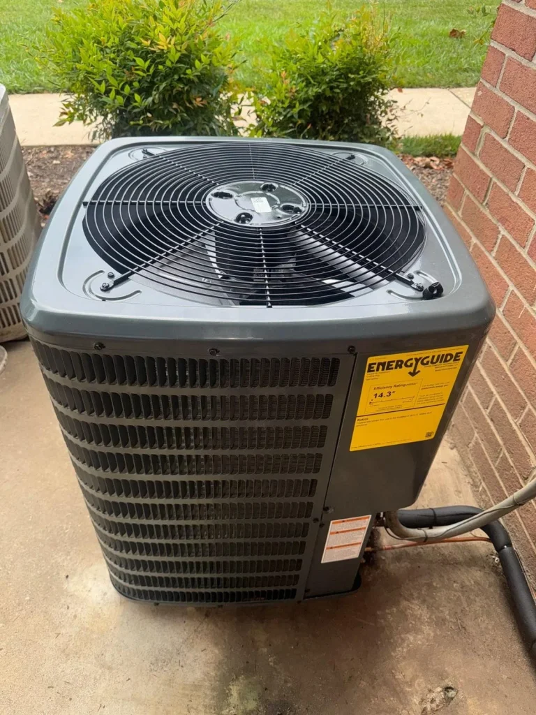 Technician reviewing SEER ratings on a new air conditioning unit
